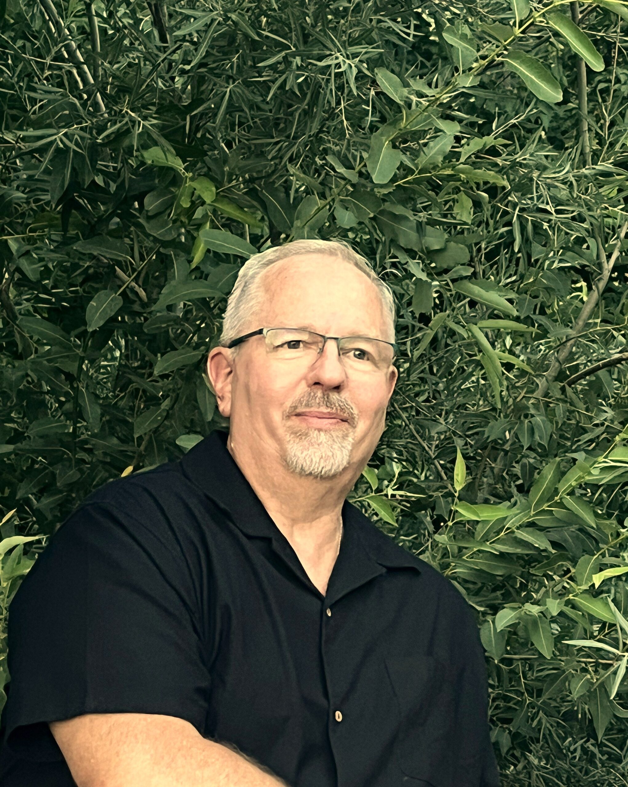 Kurt Shinn surrounded by natural greenery